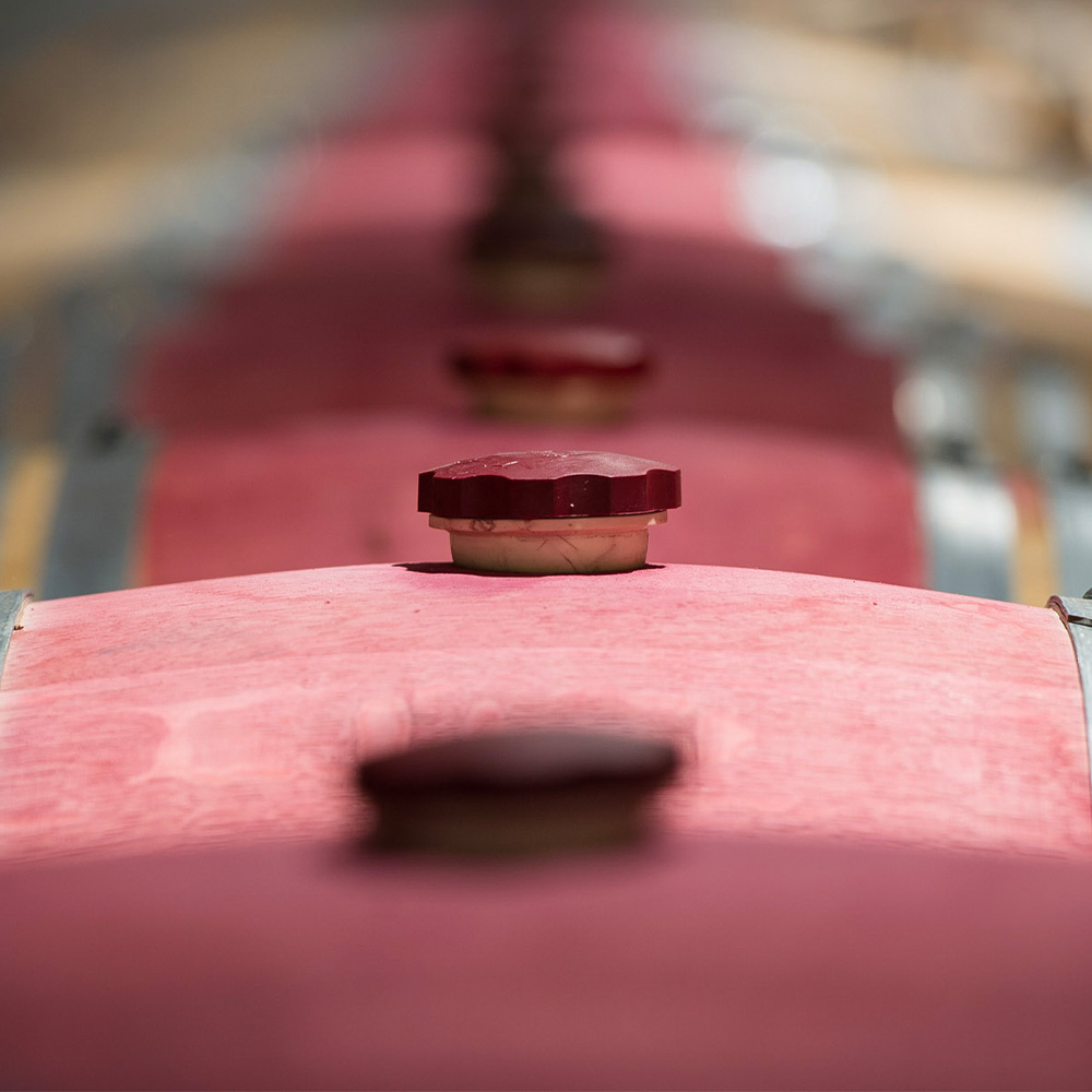 A wine barrell with red accents