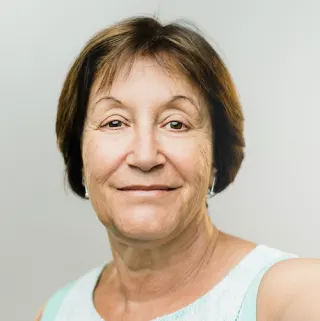 Headshot of older woman with short brown hair. 