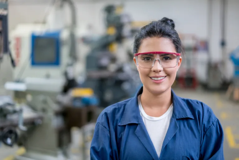 Woman with googles on shop floor