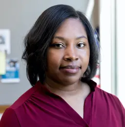 Black woman standing in room