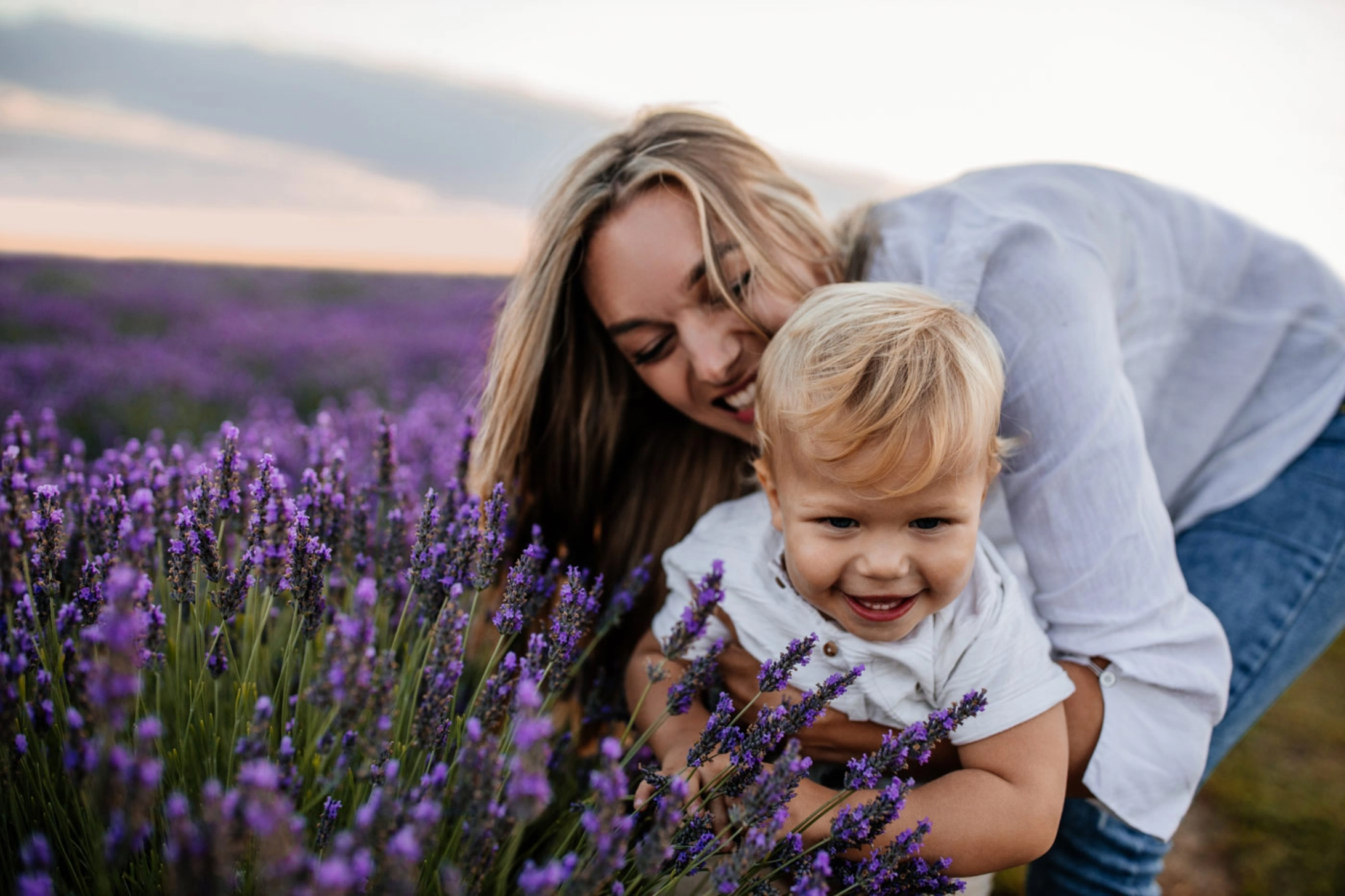 Mother holding son in a lavender field