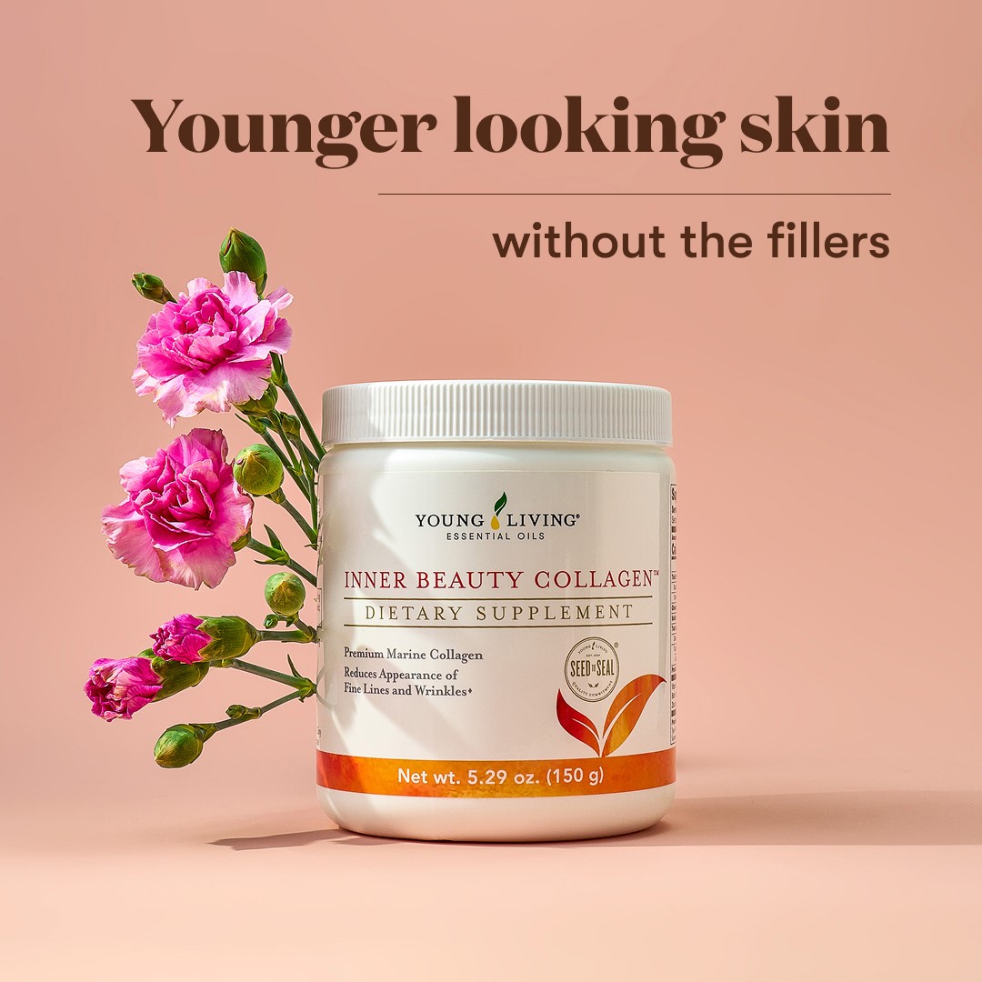 Young Living Inner Beauty Collagen jar placed upright with fresh pink carnation flowers beside it on a light peach background. Text above reads: Younger looking skin without the fillers.