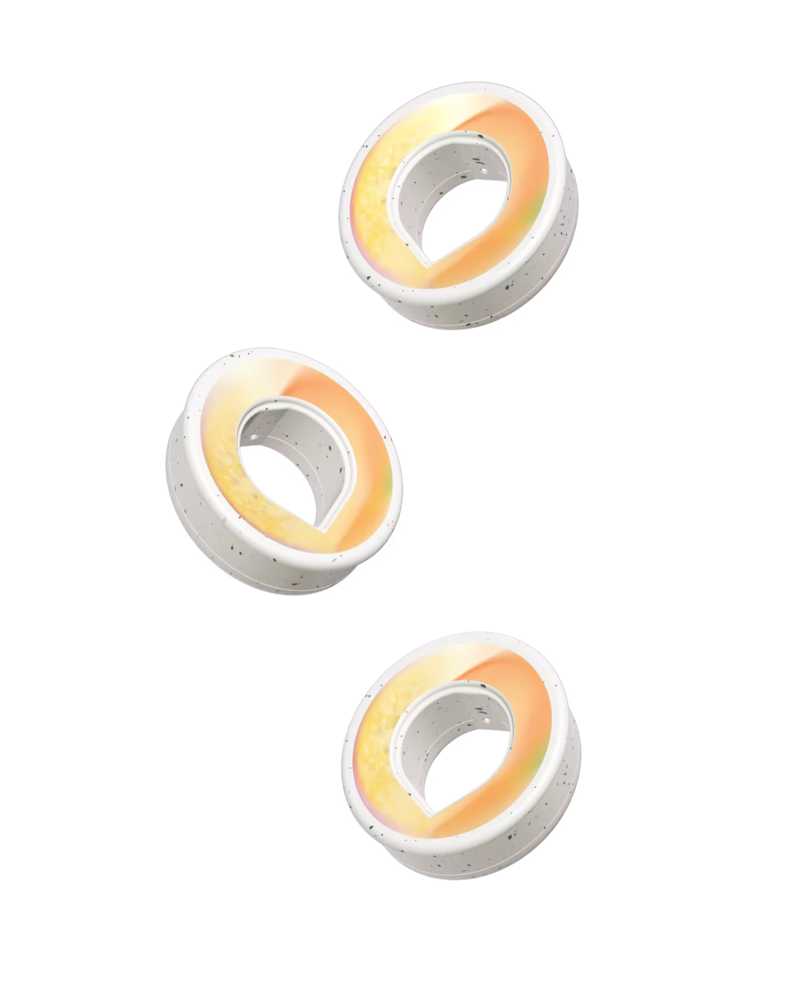 Three speckled air up pods with a yellow and orange fruit scent inside