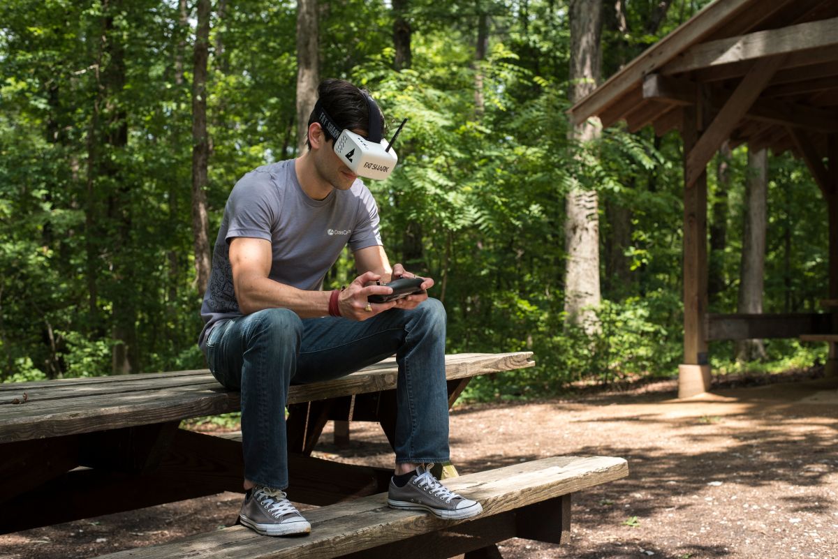 Mike on picnic bench with VR headset