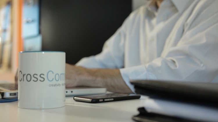CrossComm Mug on desk