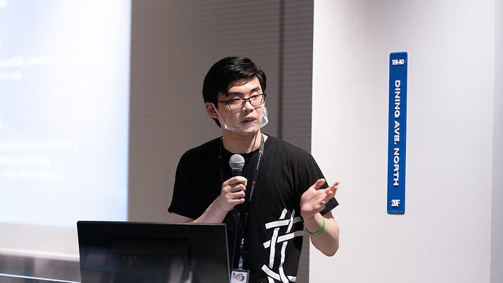 A Woven Planet employee presenting a speech at the Woven City meetup event