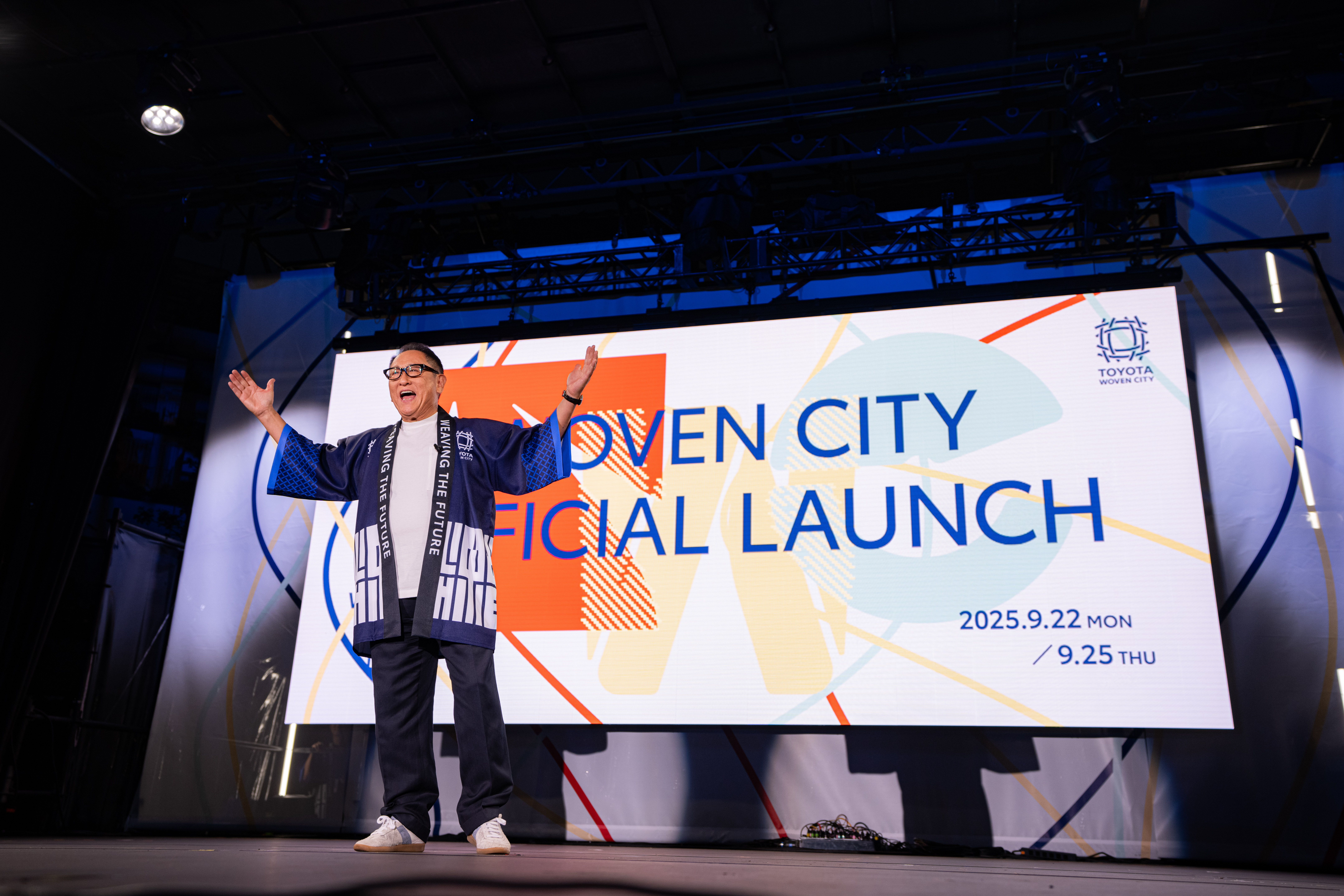 Toyota Chairman Akio Toyoda delivery a speech on stage at Woven City's official launch event