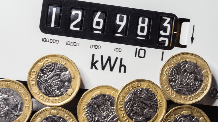 Energy meter with £1 coins below it.