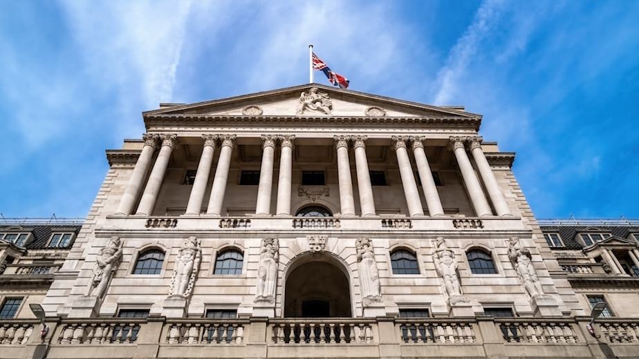 Outside of the Bank of England against a blue sky.