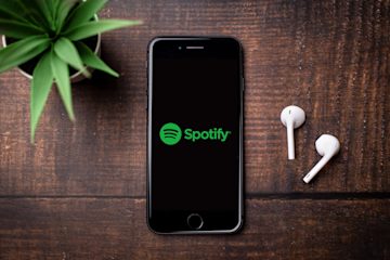A mobile phone with the Spotify logo