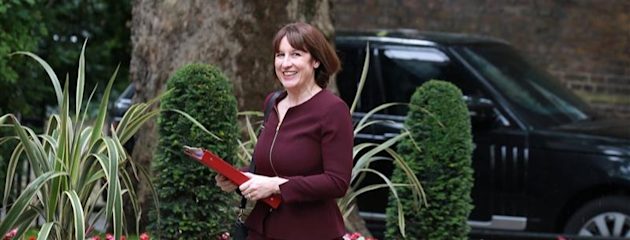 Chancellor Rachel Reeves carrying a red folder