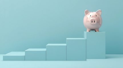 A pink piggy bank at the top of an ascending staircase of light blue blocks