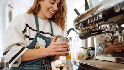 A teenager working in a café.