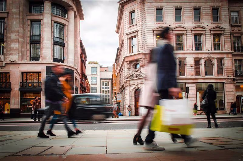 People with shopping bags on a high street