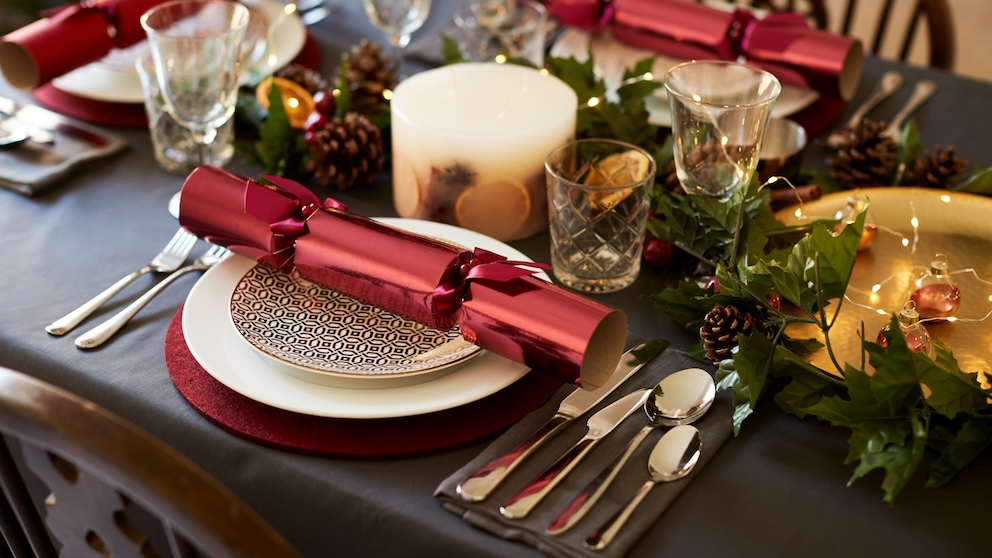 A Christmas cracker on a festive dinner table