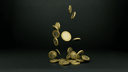 Shiny pound coins falling through the air like confetti