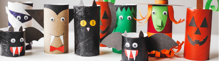 Toilet roll tubes that have been decorated as vampires, bats, pumpkins and other Halloween-themed characters.