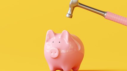 A piggybank about to be smashed by a pink hammer against a yellow background.