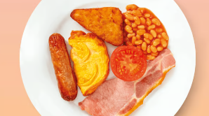 Breakfast on a plate including a sausage, egg, hash brown, bacon, tomato and baked beans
