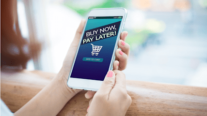 Woman using buy now pay later on her mobile phone