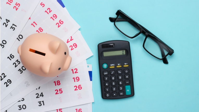 hero-homepage-new-tax-year-calendar-piggy-bank-calculator-glasses.png