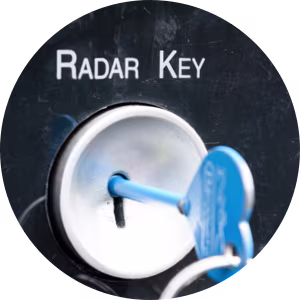 A close-up of a radar key in a keyhole.