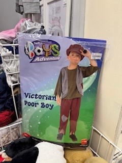 Image shows a costume in a charity shop called 'Victorian Poor Boy' for £3
