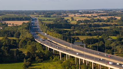 Aerial view of cars driving along the M6 motorway