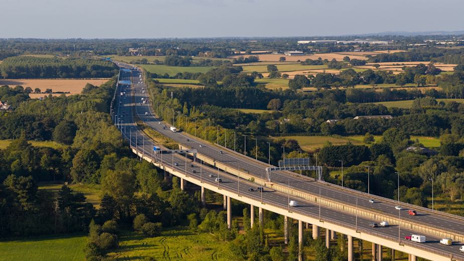 Aerial view of cars driving along the M6 motorway