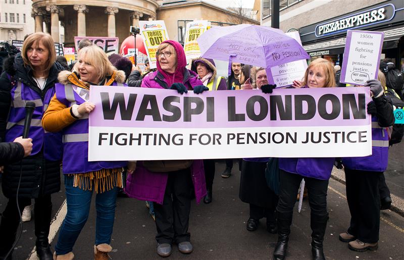 A group of women holding a banner that says 'WASPI LONDON, fighting for pension justice'.