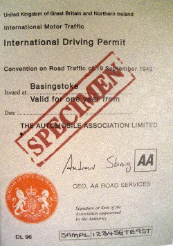 An example of an international driving permit, with the name visible, and the word SPECIMEN stamped across the middle in red ink.