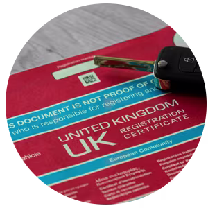 A close-up of a V5 vehicle log book.