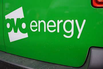 Back of a green Ovo Energy van with the logo on it.