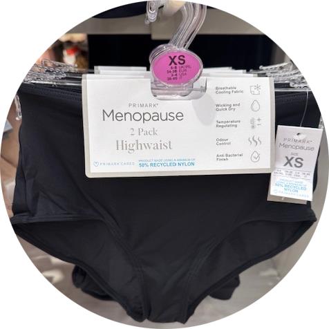 A pair of knickers branded as menopause knickers. the knickers are black, on a hanger. They're in primark.