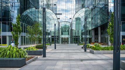 Exterior of the shiny glass and steel office tower housing the Financial Ombudsman Service head office