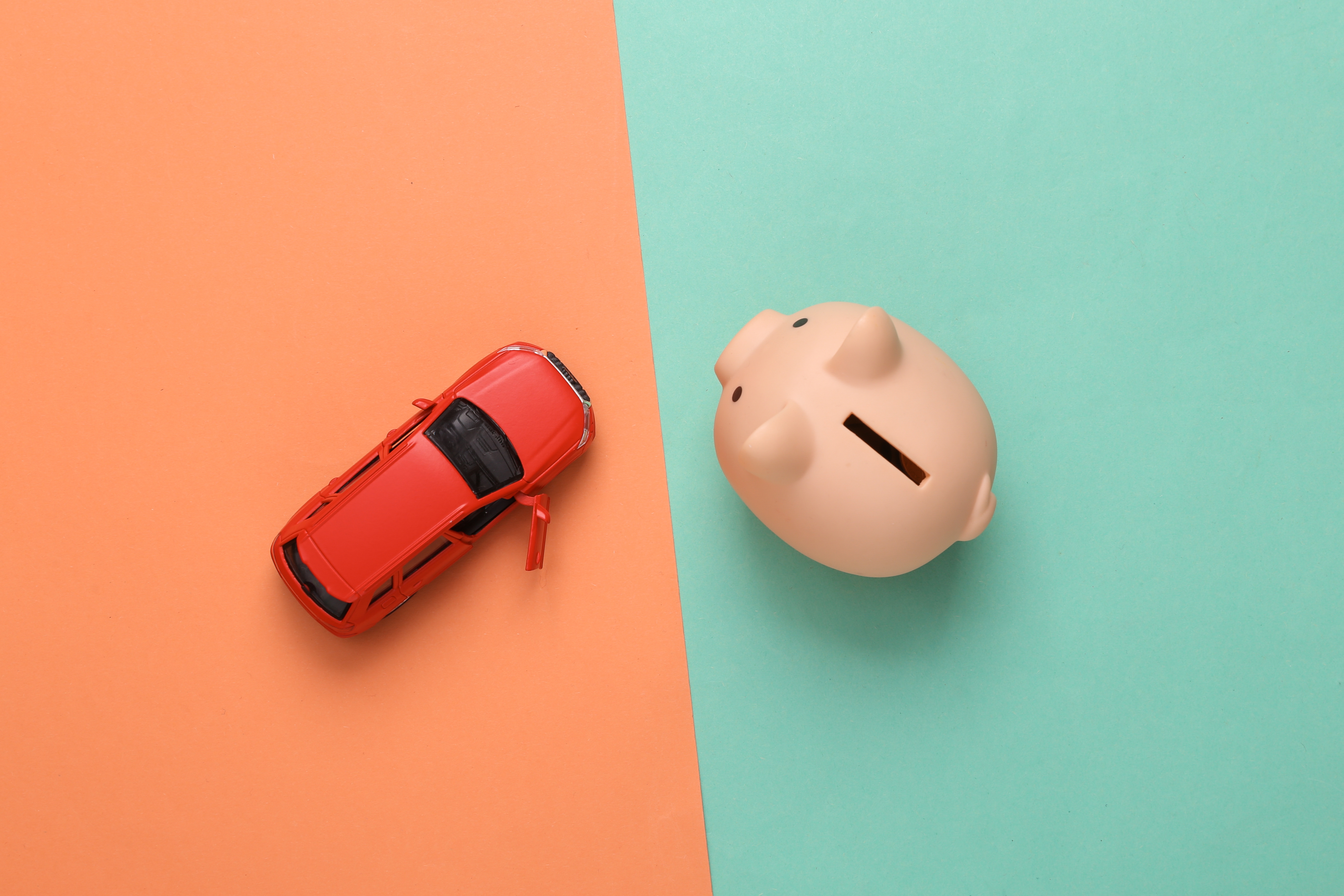 Miniature car toy and a piggy bank