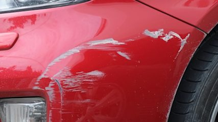 car with damage over the wheel