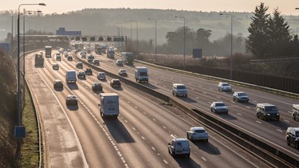 Overhead view of cars and vans driving along a motorway