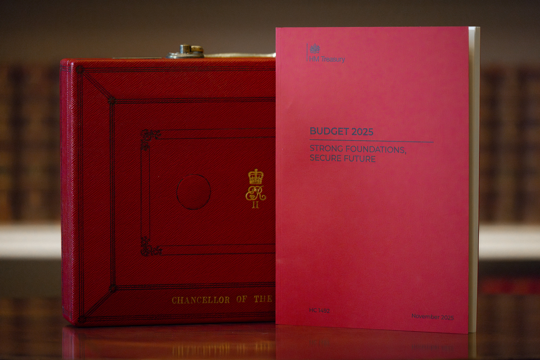 A copy of the Autumn Budget 2025, in front of the Red Budget Box, a symbolic briefcase used by the Chancellor to carry the budget speech from Downing Street to the House of Commons