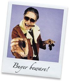 Polaroid of a stereotypical dodgy car dealer with the words 'buyer beware!' on the bottom.
