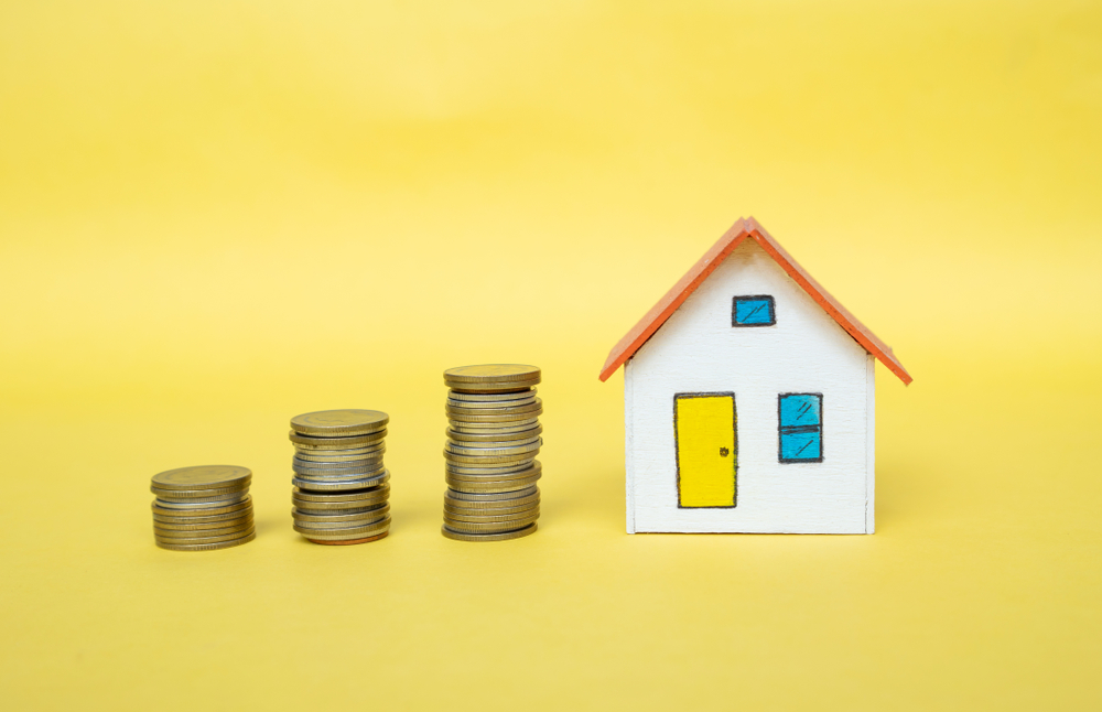 igd-hero-mortgage-life-insurance-yellow-house-coins.jpg