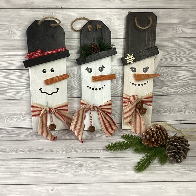 snowmen decorations made with salvaged wood