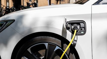 Close-up of electric charger plugged into an electric car