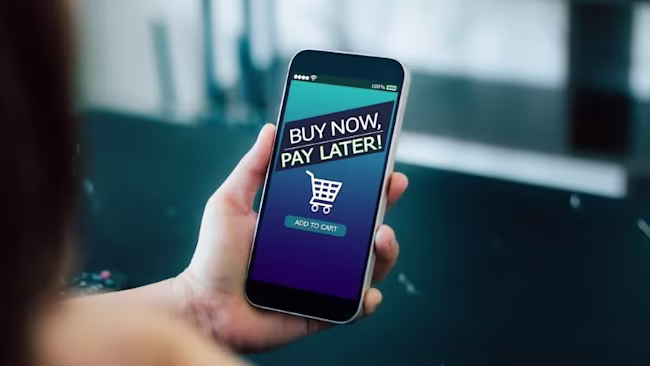 A woman using buy now, pay later on her phone.