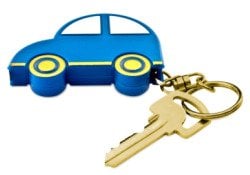 A blue and yellow car-shaped keyring attached to a gold car key.