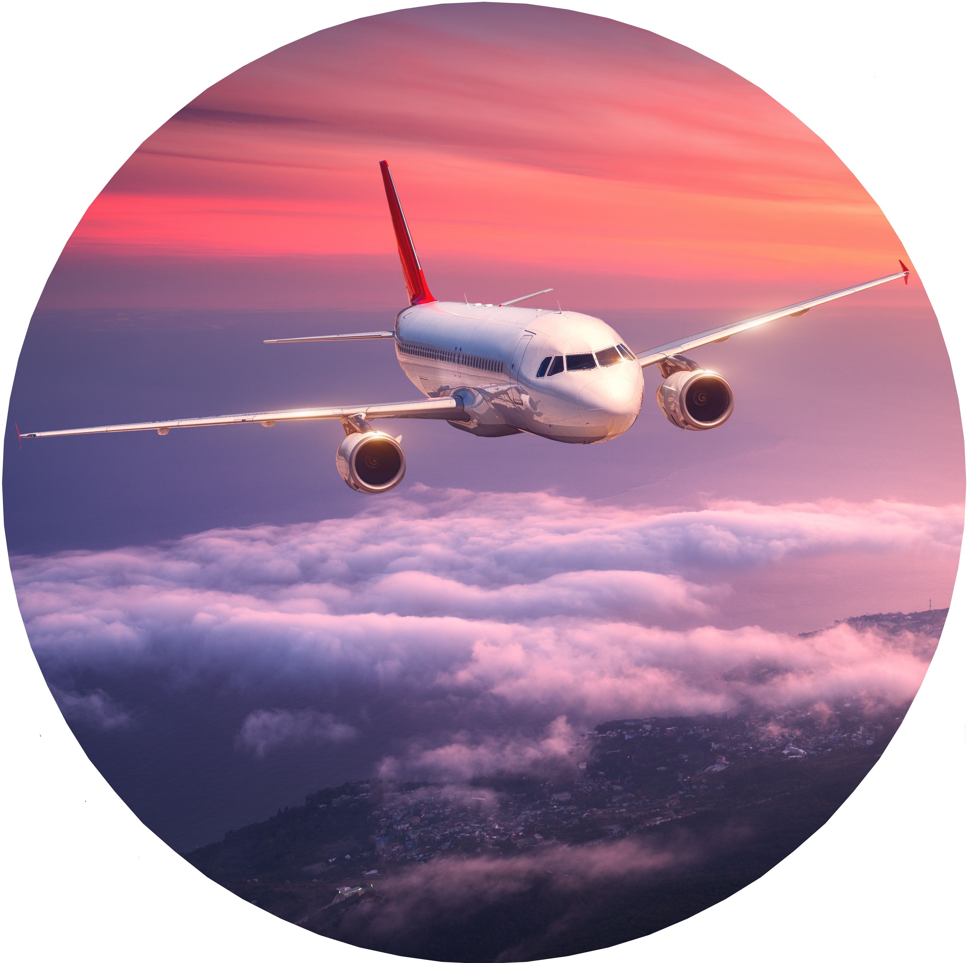 A plane flying above the clouds against a purple and pink sunset.