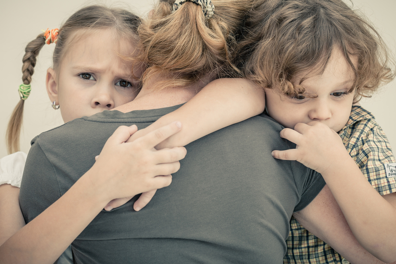 children_hugging_grief.png