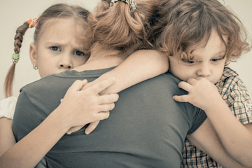 children_hugging_grief.png