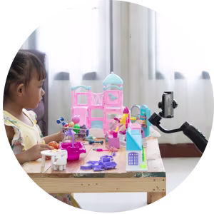 Little girl making a toy review video.