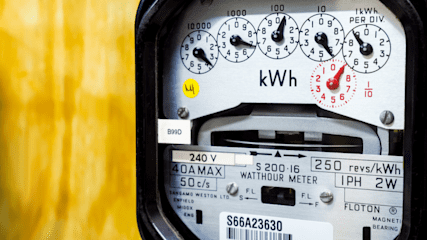 A dial electricity meter, showing usage in kilowatt hours (kWh).